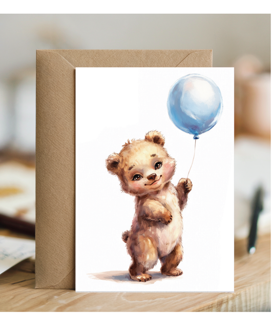 Bear cub with blue balloon
