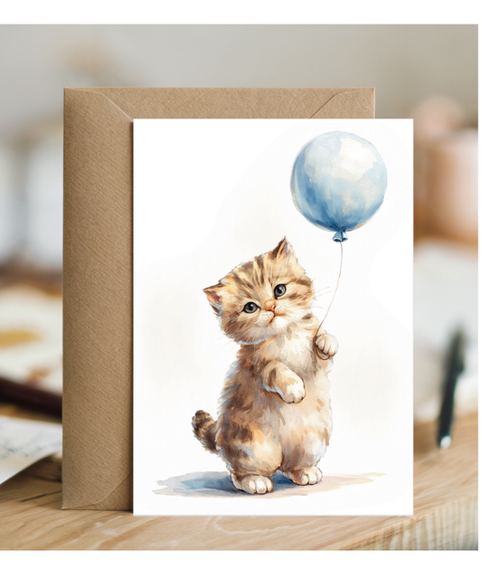 Kitten with a blue balloon