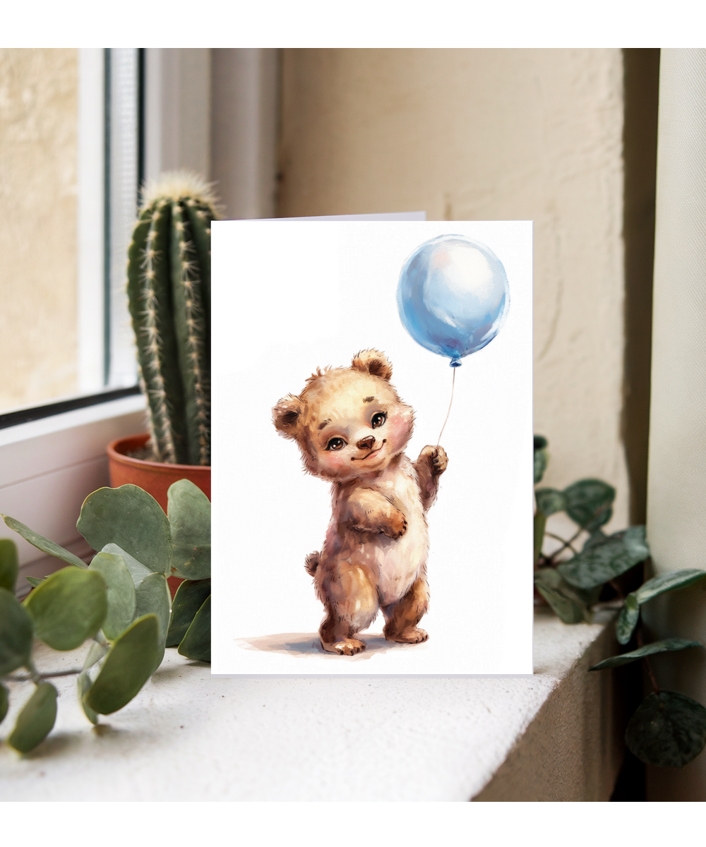 Bear cub with blue balloon