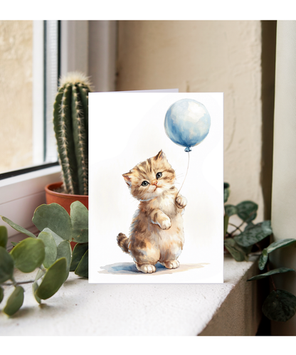 Kitten with a blue balloon
