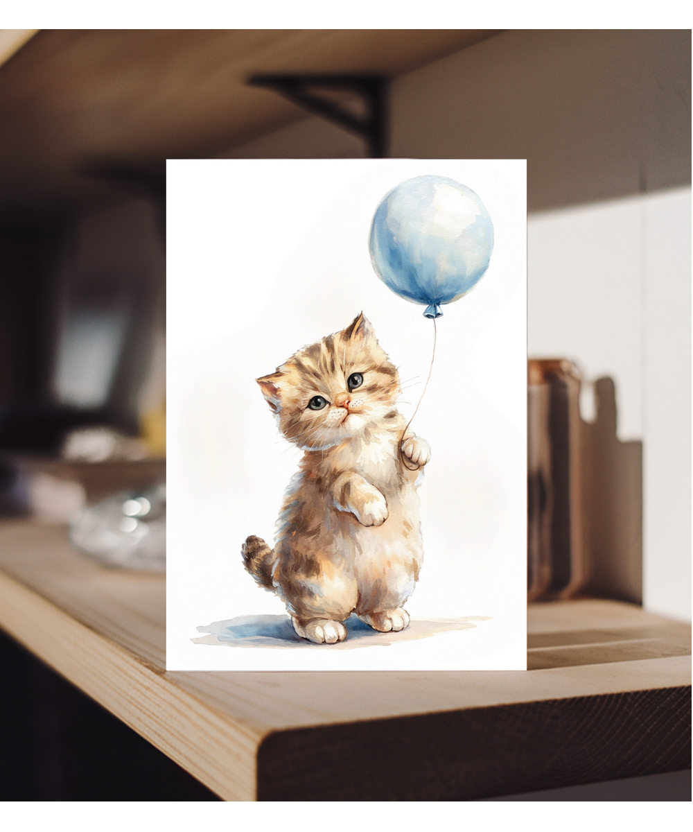 Kitten with a blue balloon