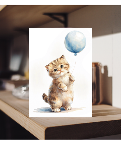Kitten with a blue balloon