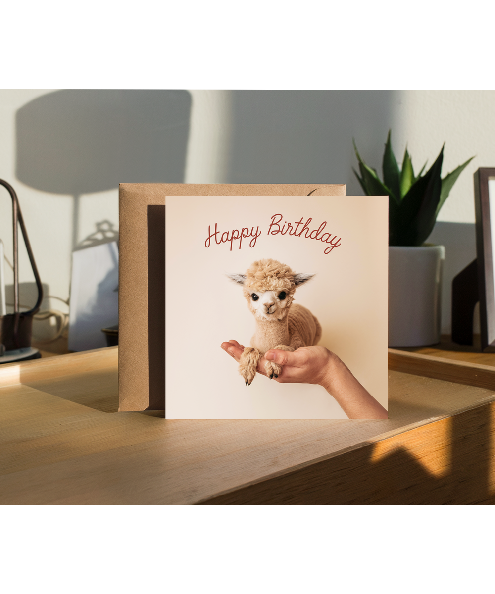 Happy Birthday card alpaca in hand cute pastel colour