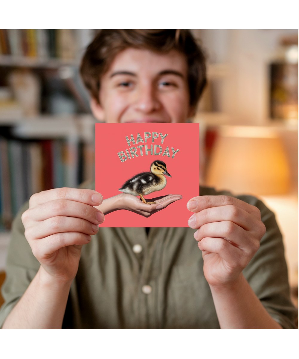 Happy Birthday card duck in hand cute coral